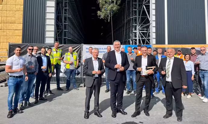 GEALAN celebrates topping-out ceremony for high-bay warehouse